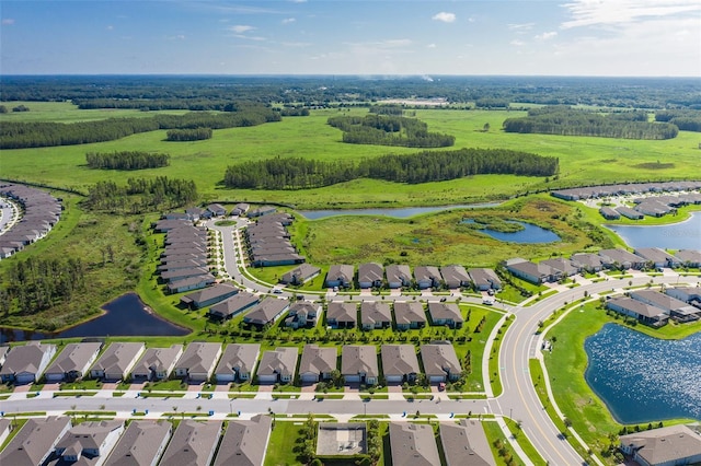 birds eye view of property featuring a water view and a residential view