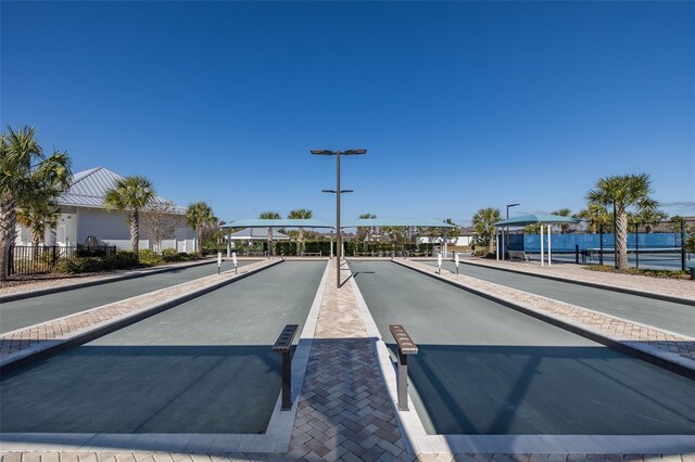 view of road with sidewalks and curbs