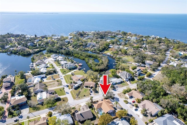 bird's eye view with a water view and a residential view