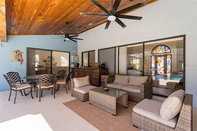 view of patio / terrace featuring outdoor dining space, an outdoor living space, and ceiling fan