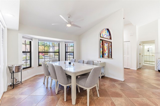 dining area with light tile patterned floors, baseboards, and ceiling fan