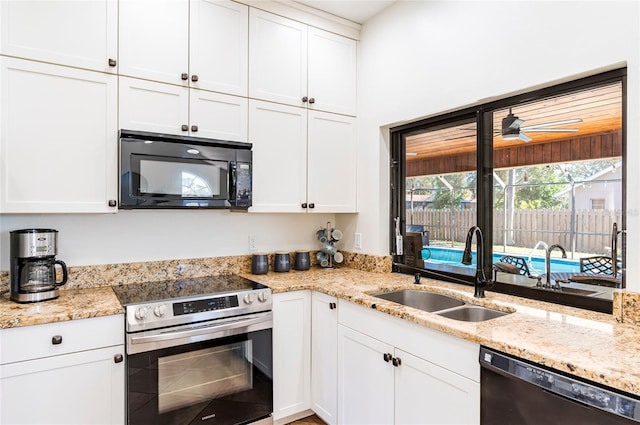 kitchen with a sink, white cabinetry, stainless steel electric range, black microwave, and dishwashing machine