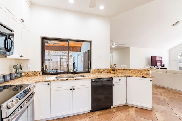 kitchen featuring visible vents, a ceiling fan, a sink, open floor plan, and stainless steel appliances