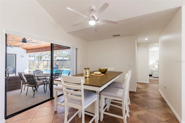 dining room with light tile patterned flooring, a ceiling fan, visible vents, and a sunroom