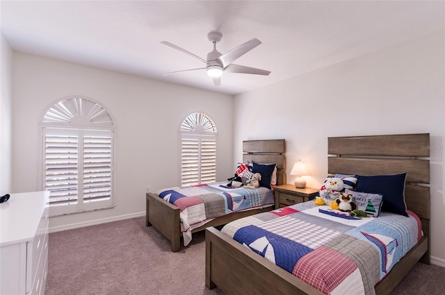 bedroom featuring carpet flooring, baseboards, and ceiling fan