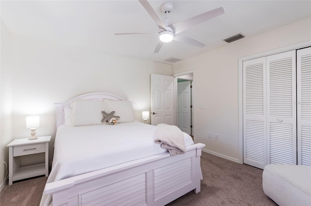 bedroom with visible vents, ceiling fan, baseboards, carpet flooring, and a closet