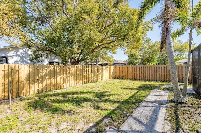 view of yard with a fenced backyard