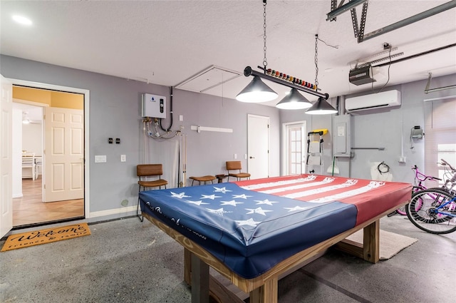 game room with baseboards, a wall unit AC, water heater, a textured ceiling, and billiards