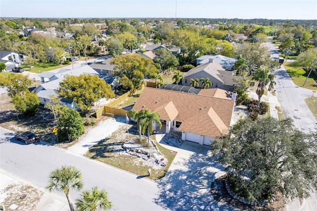 birds eye view of property with a residential view