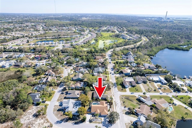 drone / aerial view featuring a residential view and a water view