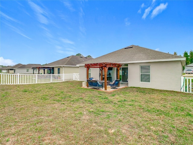 rear view of house featuring stucco siding, a fenced backyard, a yard, a patio area, and a pergola