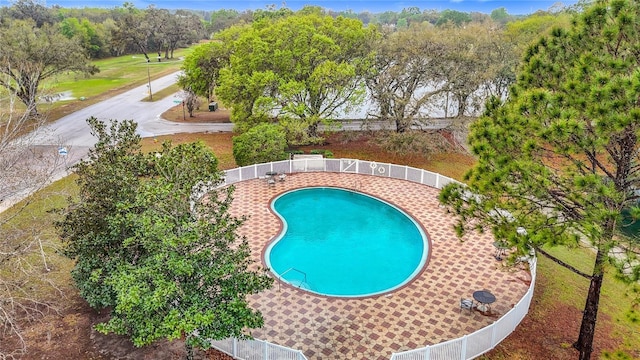 view of swimming pool with a fenced in pool and a fenced backyard