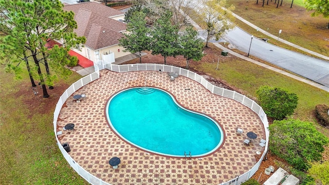 view of swimming pool featuring a fenced in pool, a patio area, and fence