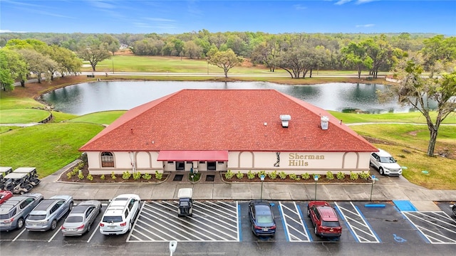 drone / aerial view with a water view