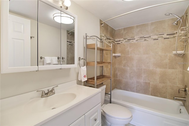 bathroom with vanity, shower / bathing tub combination, and toilet