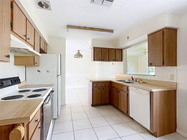 kitchen featuring electric range, white dishwasher, a sink, light countertops, and under cabinet range hood