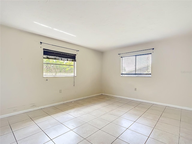 empty room featuring baseboards