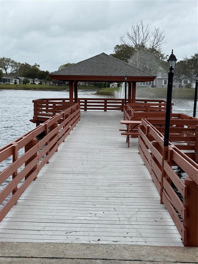 dock area featuring a gazebo and a water view