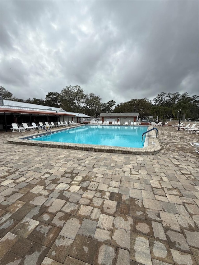 pool featuring a patio area