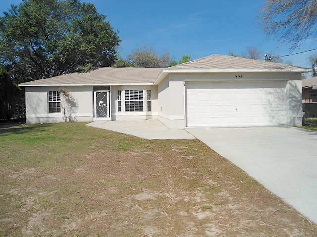 single story home featuring stucco siding, a front yard, concrete driveway, and an attached garage