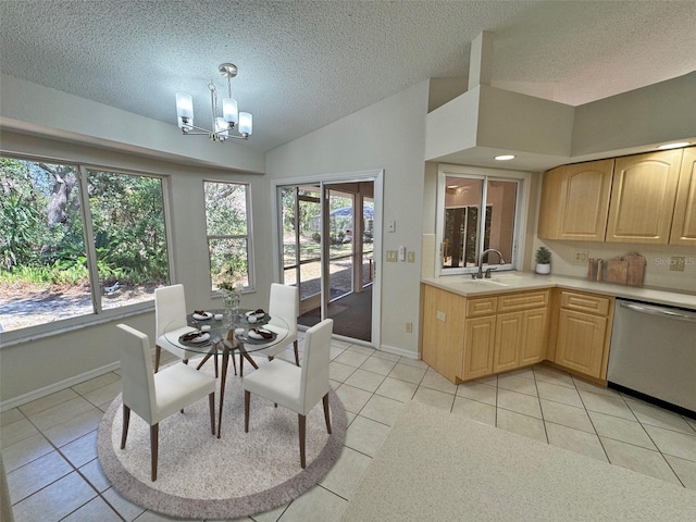 dining area featuring baseboards, a chandelier, vaulted ceiling, light tile patterned flooring, and a textured ceiling