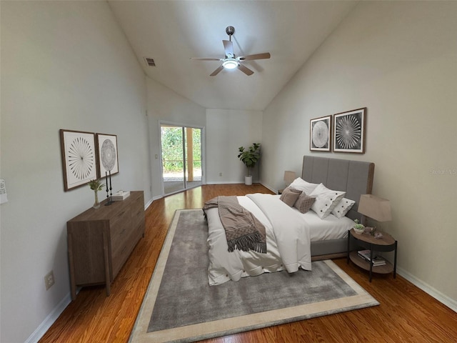 bedroom featuring visible vents, high vaulted ceiling, wood finished floors, baseboards, and access to exterior