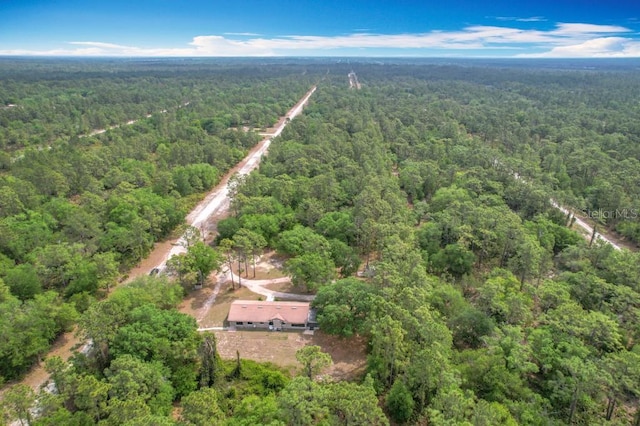 aerial view with a wooded view