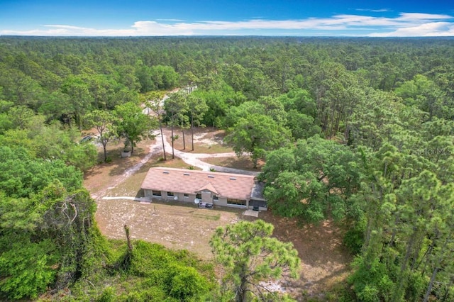 aerial view featuring a view of trees