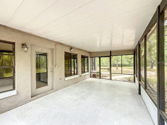 unfurnished sunroom with a healthy amount of sunlight