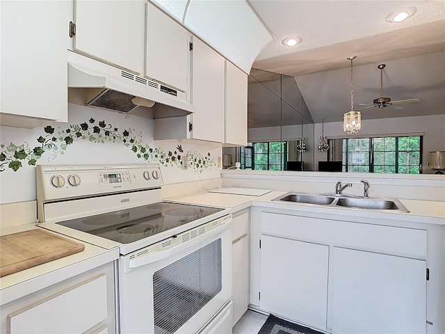 kitchen with under cabinet range hood, a sink, a healthy amount of sunlight, and white electric range oven