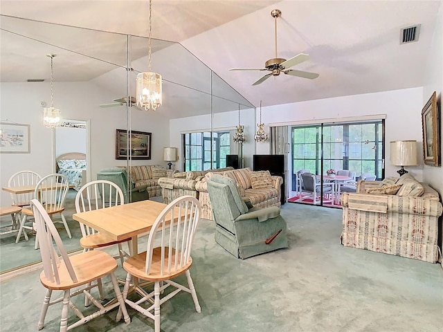 dining room featuring a wealth of natural light, visible vents, lofted ceiling, and ceiling fan with notable chandelier