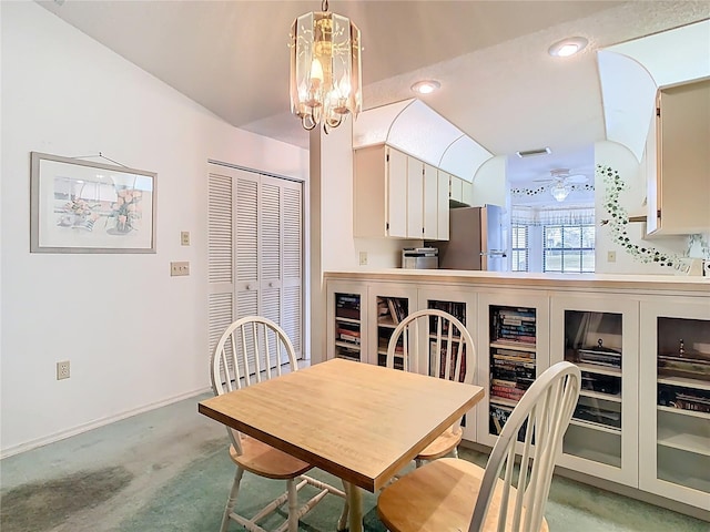 dining area featuring visible vents, baseboards, recessed lighting, light carpet, and a notable chandelier