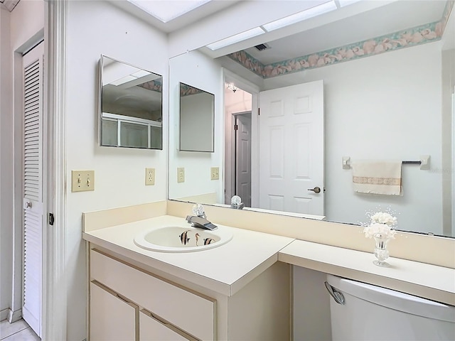 bathroom with visible vents and vanity