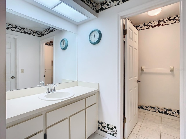 bathroom featuring vanity and tile patterned flooring