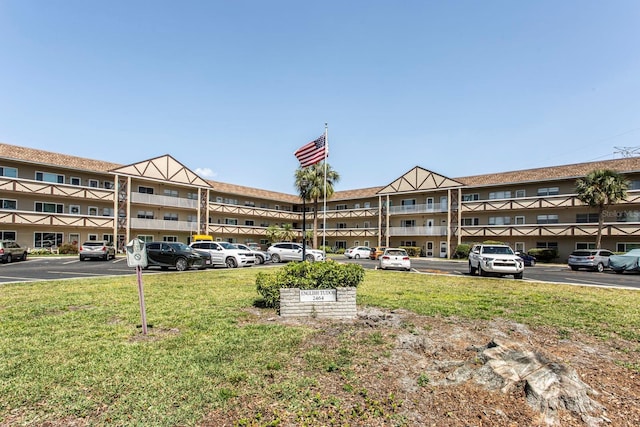 view of property featuring uncovered parking