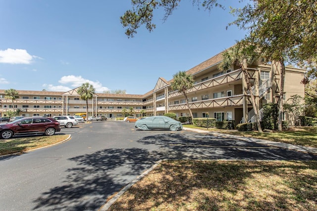 view of property with uncovered parking