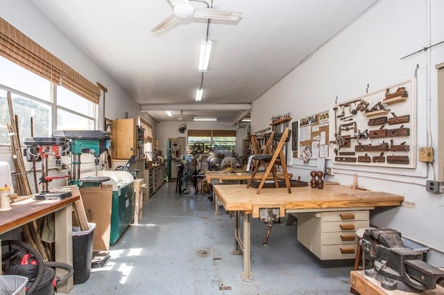 garage featuring a workshop area and ceiling fan