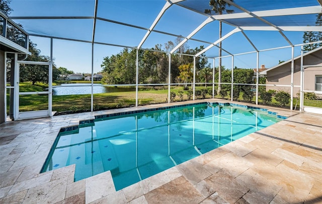 pool featuring a patio, a water view, and a lanai