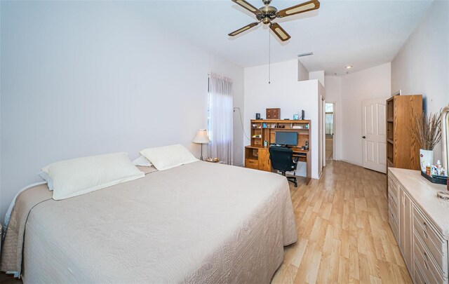 bedroom with light wood-style flooring, multiple windows, a ceiling fan, and visible vents