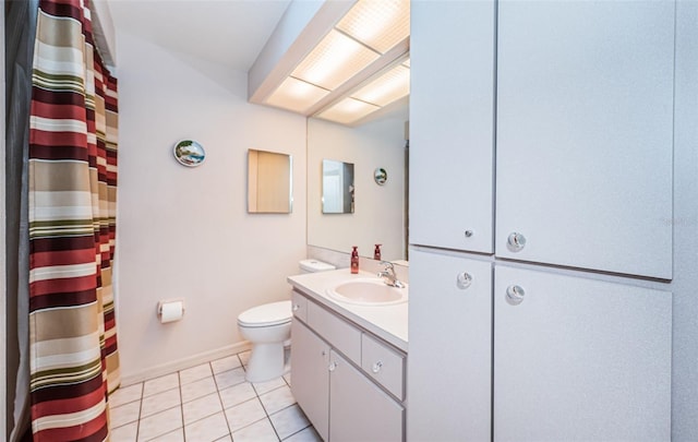 bathroom featuring vanity, a shower with curtain, baseboards, tile patterned floors, and toilet