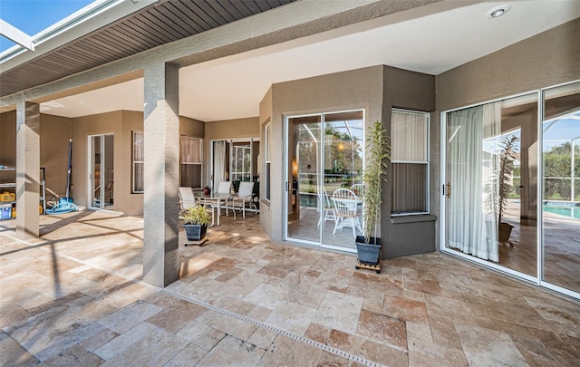 view of patio with a lanai