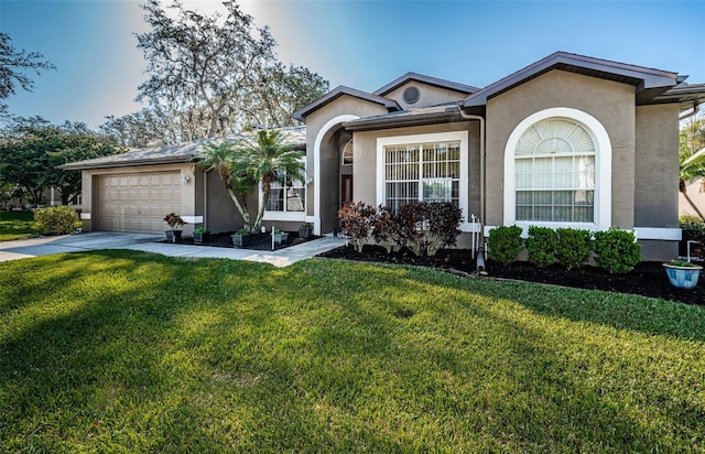 ranch-style home featuring a front lawn, an attached garage, driveway, and stucco siding