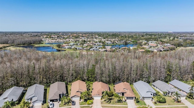 drone / aerial view featuring a residential view and a water view