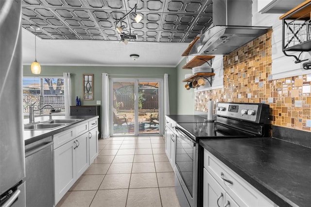 kitchen with a sink, open shelves, tasteful backsplash, range hood, and appliances with stainless steel finishes