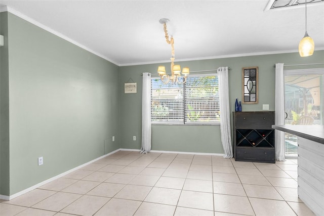 unfurnished dining area with baseboards, a chandelier, light tile patterned flooring, and ornamental molding