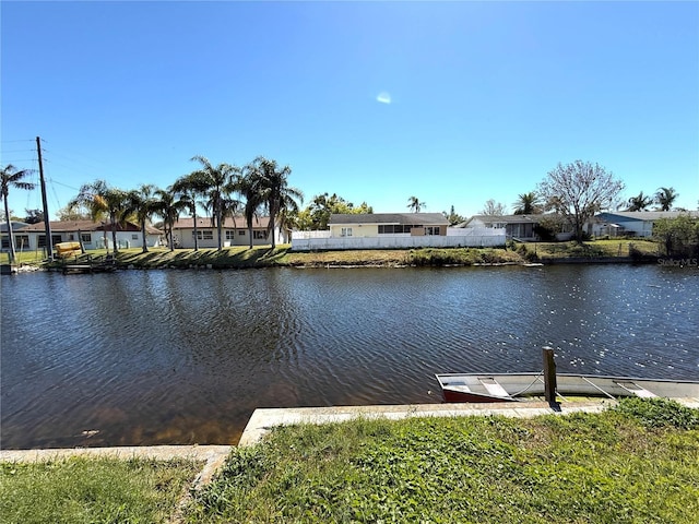 water view featuring a dock and a residential view