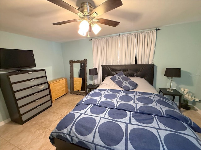 bedroom featuring tile patterned flooring and ceiling fan