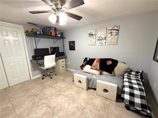 office space with visible vents, baseboards, light tile patterned flooring, and a ceiling fan