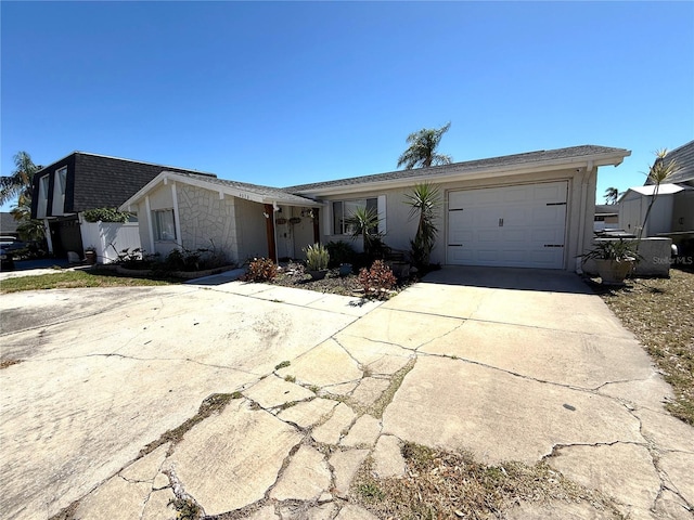 view of front of house featuring concrete driveway and a garage