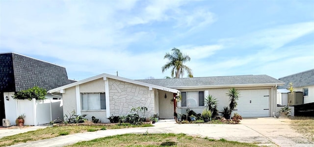 4030 Grayton Dr, New Port Richey, FL 34652 - ranch-style home featuring roof with shingles, driveway, fence, a garage, and stucco siding